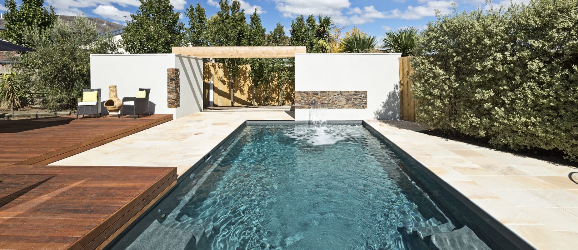 Compass-Pools-Australia_Highton-X-Trainer-fibreglass-pool-installation-with-water-wall-water-feature